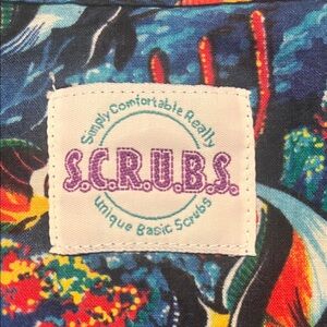 Smart Scrubs Multicolor Tropical Print Scrub Top with Purple Logo